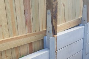Fence bracket with Durawall retaining wall